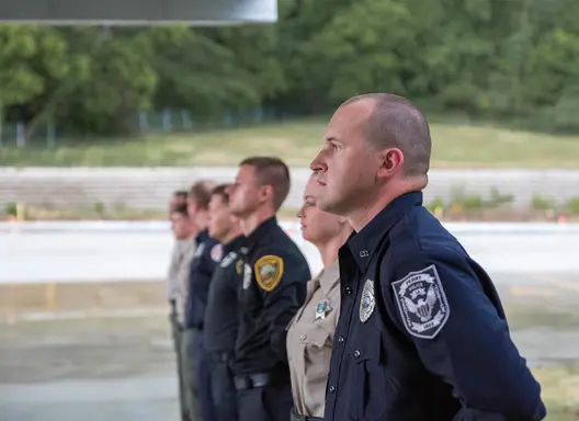 Officers standing in a line in uniform