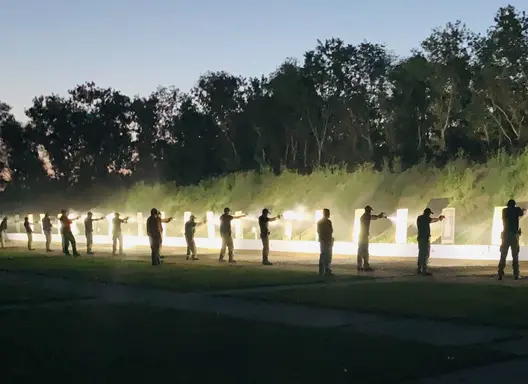Recruits shooting at targets at night